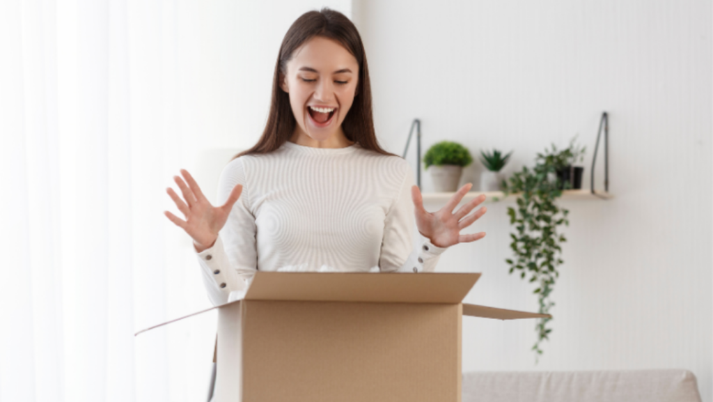 Woman excited to receive and open a gift