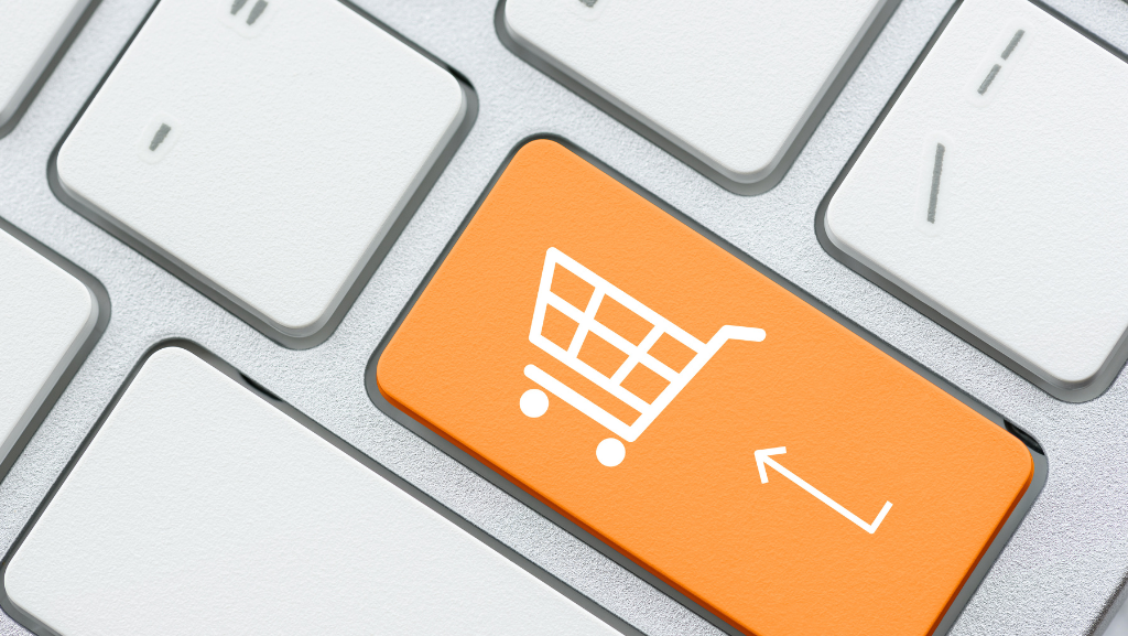 Computer keyboard showing shopping cart on return key